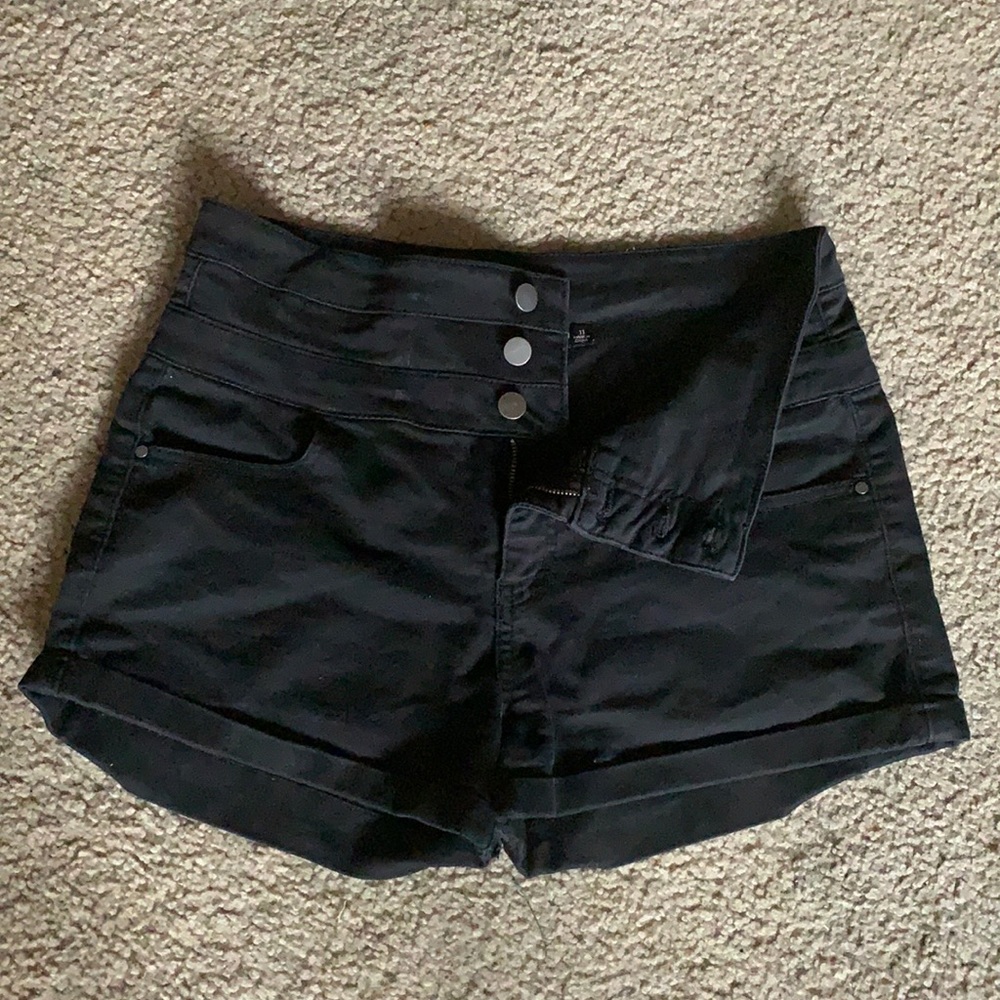 Black three button high waisted shorts.
